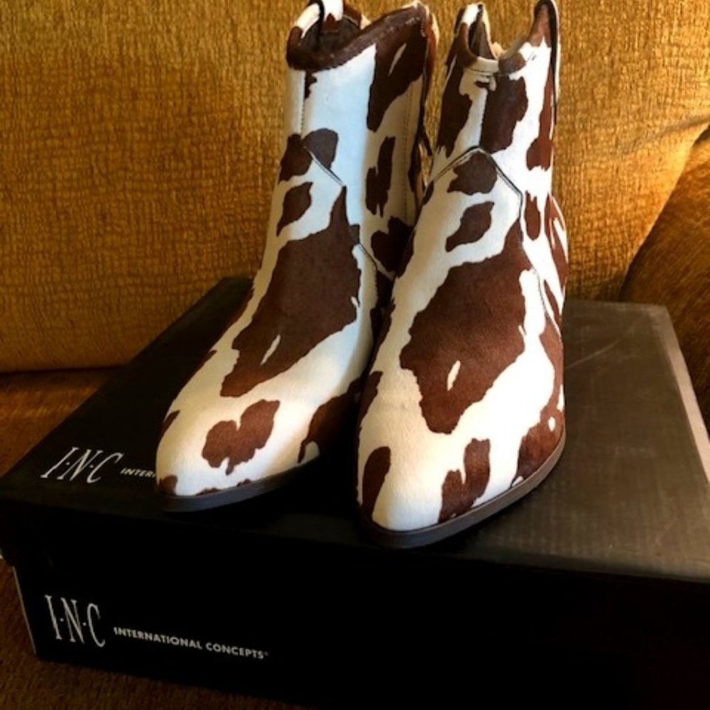 Western bootie in brown and white faux cow skin.